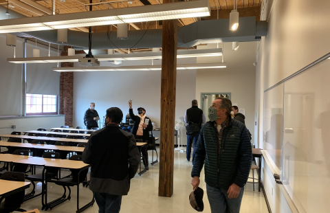 Audio visual staff inspect a classroom at Plymouth State University