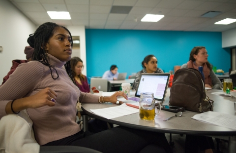 A photo of college students listening to a lecture in a classroom