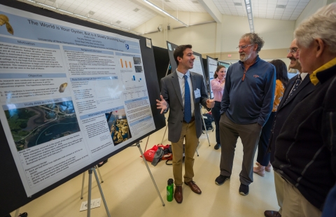 Student Presents His Work at Undergraduate Resource Fair