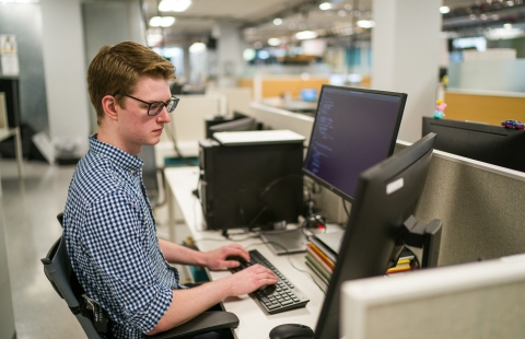 Student working at a desktop computer