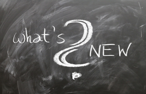 Photo of a blackboard with the phrase What's new? written on it