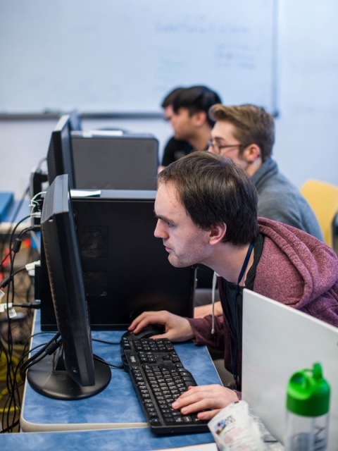 UNH team members competing in a cyber security event.
